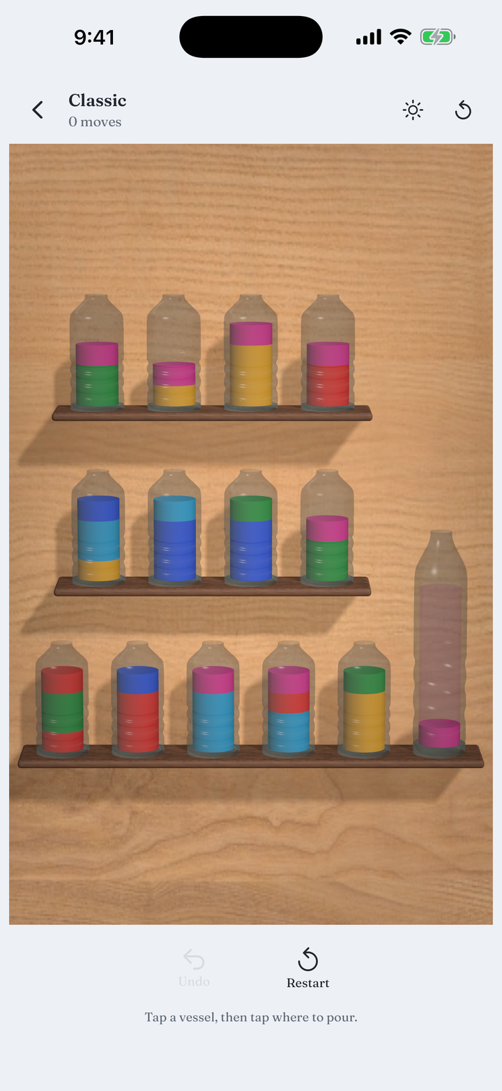A board of glass vessels filled with layered colour